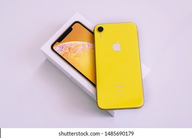 22.08.2019 Ukraine: Closeup Yellow Iphone Xr On Isolated Background.