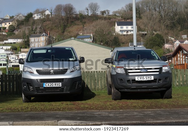 22nd February 2021- A Peugeot Expert panel van and a\
Ford Ranger pick-up, commercial vehicle\'s belonging to Natural\
Resources Wales, parked on a grass verge in Pendine,\
Carmarthenshire, Wales,\
UK.