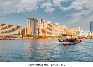 23 February 2021, Dubai, UAE: Abra Dhow wooden boat by RTA transport passengers wearing face masks from one bank of the Dubai Creek to the other