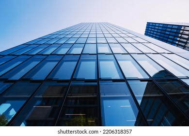 23 July 2022, Dusseldorf, Germany: Abstract Low Angle View Of A Glass Business Skyscraper Building