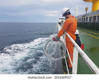 23March2021 At Red Sea. Ship Crews Are Fitting Razor Wire Around The Ship To Protect Ship From Piracy Attack During Transiting Red Sea Which Is A High Risk Area.