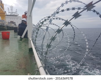 23March2021 At Red Sea. Ship Crews Are Fitting Razor Wire Around The Ship To Protect Ship From Piracy Attack During Transiting Red Sea Which Is A High Risk Area.