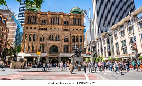 23rd December 2018, Sydney NSW Australia : Facade View Of The Queen Victoria Building Or QVB With Lot Of People Crossing The Road In Sydney NSW Australia