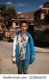 23rd December 2021 Litang, Garze, China: Portrait of young tibetan student on the street of Litang.