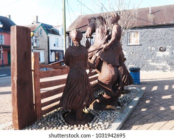 23rd February 2018- A Wooden Sculpture Depicting The Rebecca Riots In The Town Center At St Clears, Carmarthenshire, Wales, UK.