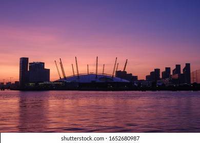 23rd July 2019 - London, UK - The O2 Arena and Intercontinental Hotel during a bridge pink, orange and purple sunrise