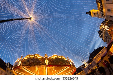 24 December 2014 SIBIU, ROMANIA. Christmas Lights, Christmas Fair, Mood And People Walking. Fish Eye Lens Effects