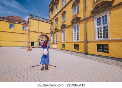 24 July 2022, Osnabruck, Germany: A Happy Girl Student Near The Campus Of The Old European University. Education And Admission To The Faculty