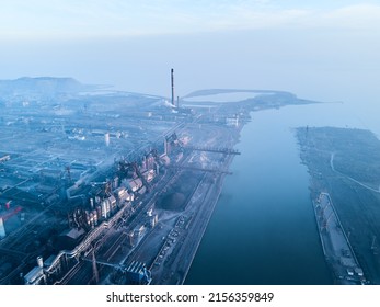 24 October 2019 - Mariupol, Ukraine. Azovstal metallurgical plant. Aerial of industrial city with air, water pollution from blast furnaces near sea of Azov. Smoke, smog from pipes of steel factory.