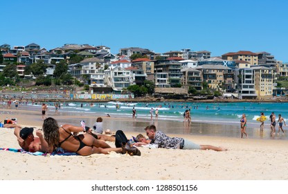 24th December 2018, Bondi Sydney Australia: Woman wearing thong or G-string bikini and Bondi beach panorama in Sydney Australia