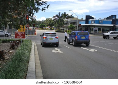 25 April 2018. Illustrative Editorial. CBD Or Central Business District, Coffs Harbour, Australia. Traffic Stopped On Red Light Signal. Image Has Person Crossing Street, Cars, Vehicles, Traffic Lights