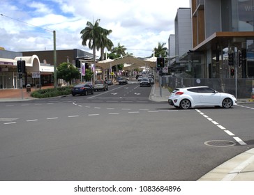 25 April 2018. Illustrative Editorial. CBD Or Central Business District, Coffs Harbour, Australia. Moving Traffic On Street. Image Has Cars, Vehicles, Road, Shops, Offices, Buildings, Footpath, Trees