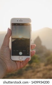 25 August 2018 - Sevan Armenia: Young Woman Taking Photo With Iphone 8 In Armenia