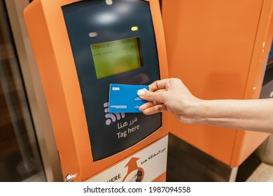 25 February 2021, Dubai, UAE: The passenger applies a contactless smart transport card RTA to pay for travel on the tram or metro in Dubai