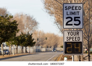 25 Mph Speed Limit Sign And Radar Speed Indicator Sign On A Street.