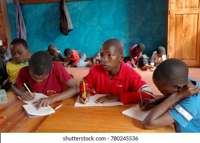 25 October 2017-Franciscan Center of Pomerini-Tanzania-Africa-A group of unidentified African children follow the after-school lessons helped by some unidentified members of a non-profit association