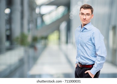 25 Year Old Entrepreneur In Blue Shirt In Office