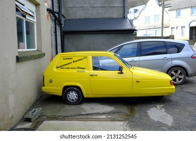 25th February 2022- An amusing Reliant Robin LX hatchback van, painted in the style of a van used in the British TV series Only Fools and Horses, in a carpark in Pendine, Carmarthenshire, Wales, UK.