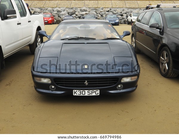 25th June 2017- A\
classic Ferrari on the sandy beach at a hot rod event in Pendine,\
Carmarthenshire, Wales,\
UK.