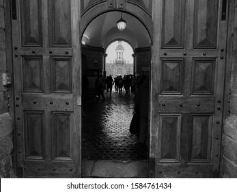 25th October 2019, Dublin, Ireland. Black And White Image Of The Entrance Into The Trinity College Through The Main Wooden Door. 