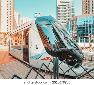 26 February 2021, UAE, Dubai: Rta modern automated tram rides in Dubai Marina district. Concept of public transport and railway interchanges
