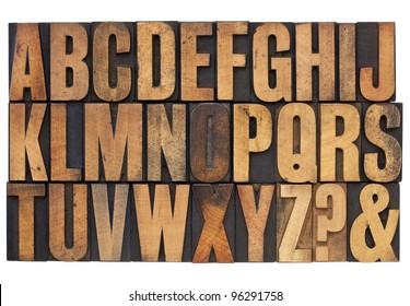 26 letters of English alphabet, question mark and ampersand - antique letterpress wood type printing blocks stained by ink patina