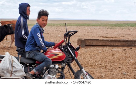 26th June, 2019: Mongolian Kid Riding A Motorbike At The Gobi Desert - Mongolia