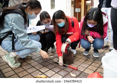 27 2 2021 Geological Female University Or College Students With Face Mask Do Field Test In A Borehole During Field Trip, University In Hong Kong