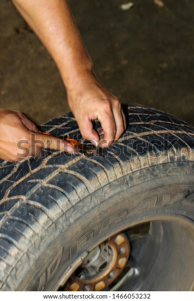 \
27 July 2019 The car\
repairman was repairing the car at the service center in the\
process of car maintenance. Pang Mapha District Mae Hong Son\
Province, Thailand