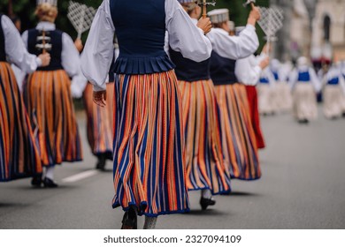27 National Song and Dance Festival, festive opening parade in the capital city Riga. Folk costumes in dresses go on parade - Shutterstock ID 2327094109