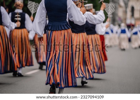 27 National Song and Dance Festival, festive opening parade in the capital city Riga. Folk costumes in dresses go on parade