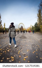 27 October 2018 - Chernobyl, Ukraine: Tourists In The Abandoned City Of Pripyat, Chernobyl Zone. Woman Tourist Walks In The Chernobyl Exclusion Zone.