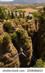 27.09.2021 Ronda. Spain - Zipline In The Center Of The Ancient City. The Man Flies Over An Abyss In The Andalusian Mountains.