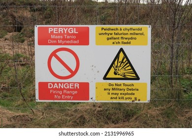 27th February 2022- A Bilingual Information And Warning Sign On The Boundary Of The Munitions Testing Range At Pendine, Carmarthenshire, Wales, UK.