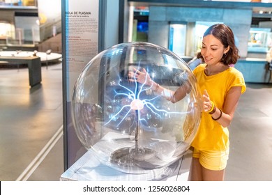 28 JULY 2018, BARCELONA, SPAIN: People Playing With Plasma Ball In Science Museum