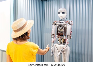 28 JULY 2018, BARCELONA, SPAIN: Young Woman Interact With Robot In Science Museum