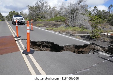 28 SEPTEMBER 2018, Volcano National Park, Hawai’i, USA - Ranger Car Parked By A Road Sinkhole, Following Earthquakes Caused By Eruption Of Kīlauea Volcano