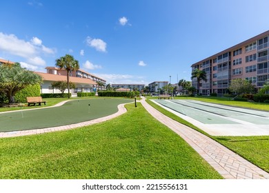 2829 Florida Blvd Delray Beach FL, Miami, USA,
June 13, 2020
Mini Golf And Shuffleboard Courts, Bench, Palm Trees, Short Grass With Paths, Buildings In The Background, And Blue Sky Background