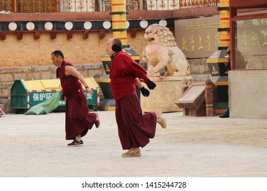 29 December 2018,Lhasa, Tibet :Two Tibetan Monk Performing “buddhist Exercise” Called Prostrations