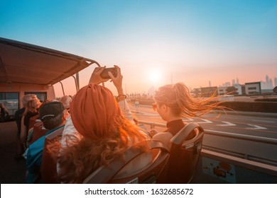 29 November 2019, Dubai, United Arab Emirates: Tourists having a trip in Dubai, while sitting on a roof of a Big Bus Tour coach