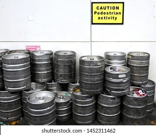 29th June 2019, Drogheda, Ireland. Image Of Beer Kegs Next To A Wall With A Sigh Saying Caution Pedestrian Activity, In Drogheda Town Centre. 