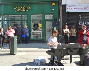 29th March 2019, Dublin, Ireland. Busker Performing On Grafton Street, Dublin City Centre. 