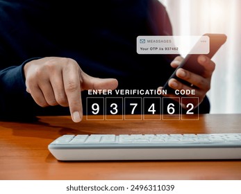 2FA or two factor authentication, cyber security concept. Password code number for enter verification code showing on computer while man hold smartphone and got sms with otp passcode for security.