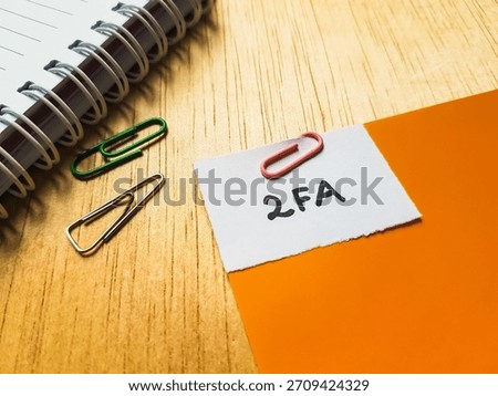 2FA writting on table background. 