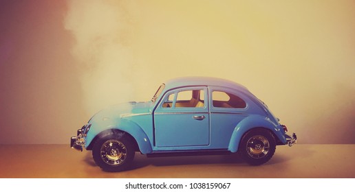 2nd March 2018. Finland, Espoo. Illustrative Editorial Toy Car Volkswagen Beetle Closeup Image. Car Is Broken And Smoke Is Coming Out From Engine. Vintage Car Model. Old Retro Beetle Car.