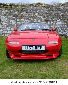 2nd May 2022- A classic Mazda MX5, two door sports car, parked in the castle grounds at Carew, Pembrokeshire, Wales, UK.