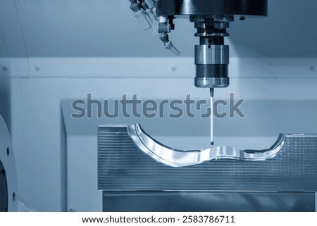 The 3 axis CMM machine measuring the mold parts in the light blue scene . The quality control of automotive parts with multi axis CMM machine.
