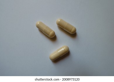 3 Beige Capsules Of Milk Thistle Extract From Above