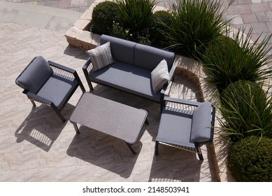 3 Black And Beige Sofas And A Table Made Of Metal In The Courtyard And Garden On The Garden Floor, Comfortable Sofa, Shot From Above