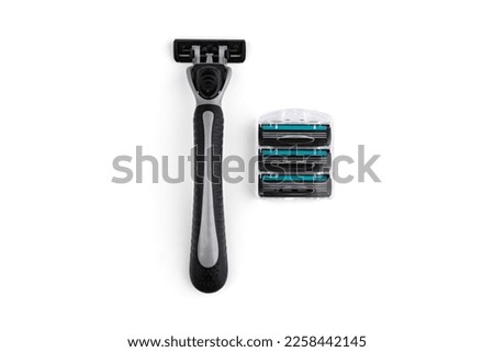 3 blades system razor with replaceable cartridges isolated on white background. Top view.